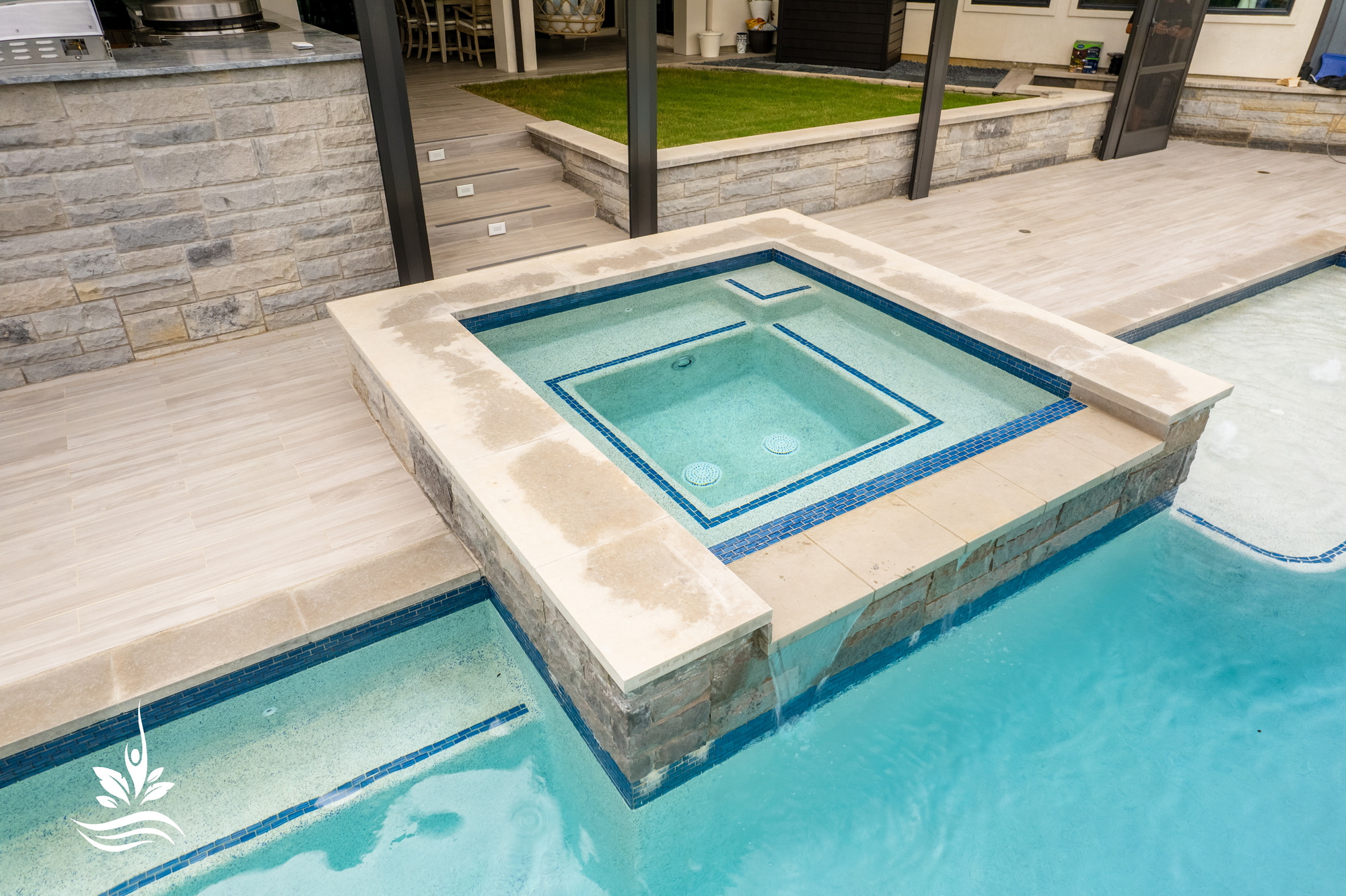 Heated swimming pool attached spa